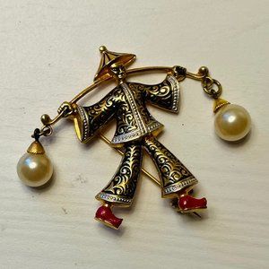 Vintage Damascene patterned brooch of man carrying pots